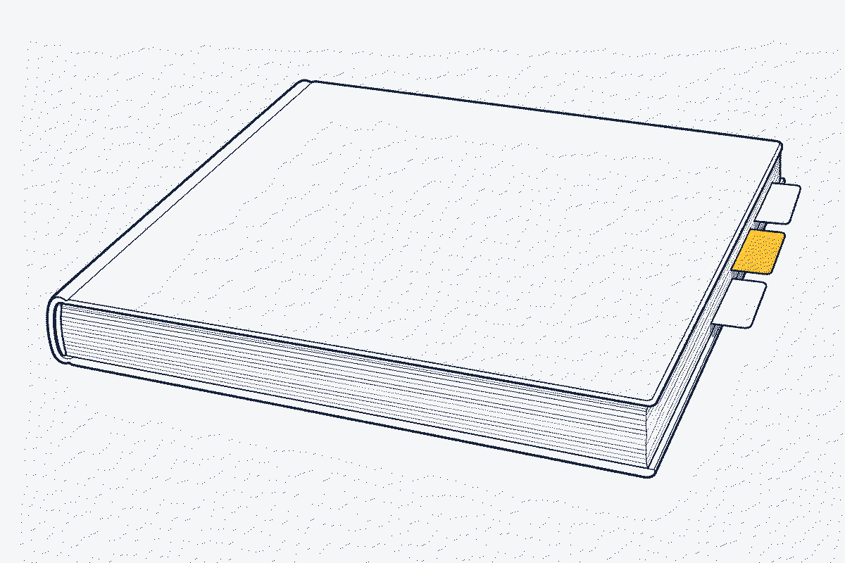 Side view of a closed car handbook with three coloured tabs marking sections near the back